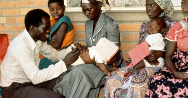 Photo of mothers holding children to be vaccinated