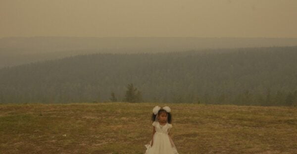 Nanna Heitmann. Siberia. Sayana at a wedding, while the air is covered with smoke from the neighboring wildfires. June 2021.