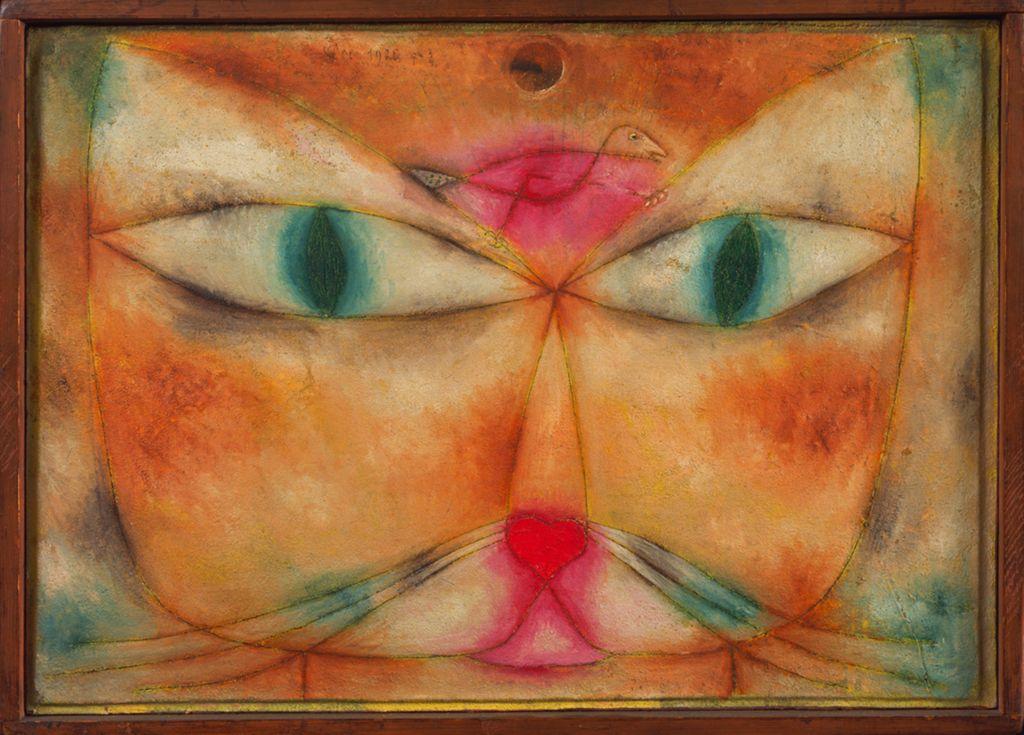 A whimsical painting of a cat’s face with large green eyes, featuring a bird perched on its forehead in warm, abstract colors.