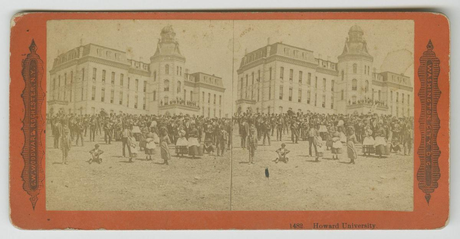 A late 19th-century stereograph depicting a large group of people gathered in front of the historic Howard University building.